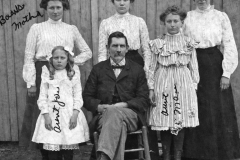 Top row: Will William's first wife, Janie Williamson, Jessie E. Williams, Mae E. Williamson, Nannie M. Williamson. Front row: Jo Stella Williamson and Will Williams.